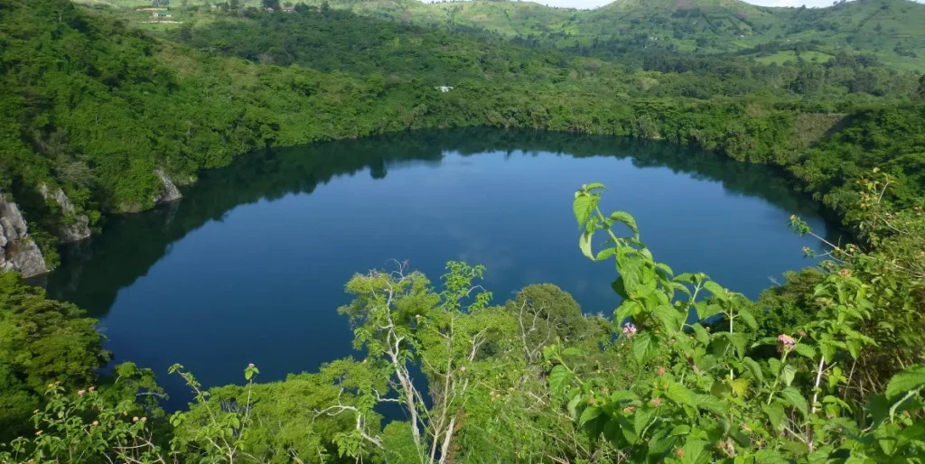 A panoramic view of the unique Toro-Semliki Crater Field, showcasing the numerous volcanic craters and surrounding landscape.