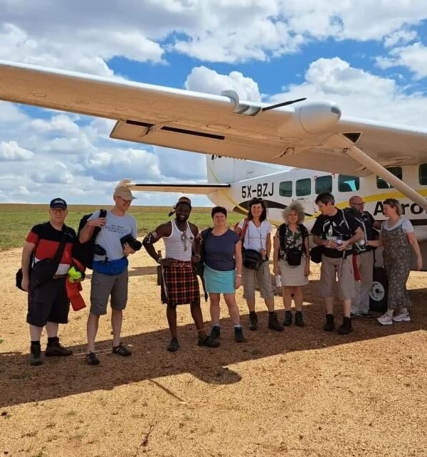 Tourists getting ready for a fly-in safari over Uganda's stunning landscapes. Aerial view of wildlife and vast terrain.