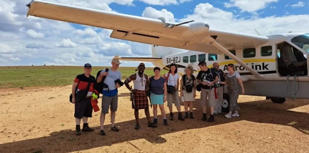 Tourists getting ready for a fly-in safari over Uganda's stunning landscapes. Aerial view of wildlife and vast terrain.