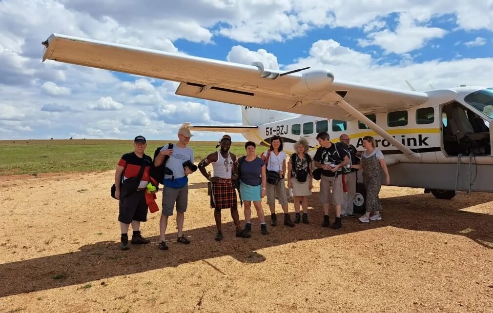 Tourists getting ready for a fly-in safari over Uganda's stunning landscapes. Aerial view of wildlife and vast terrain.